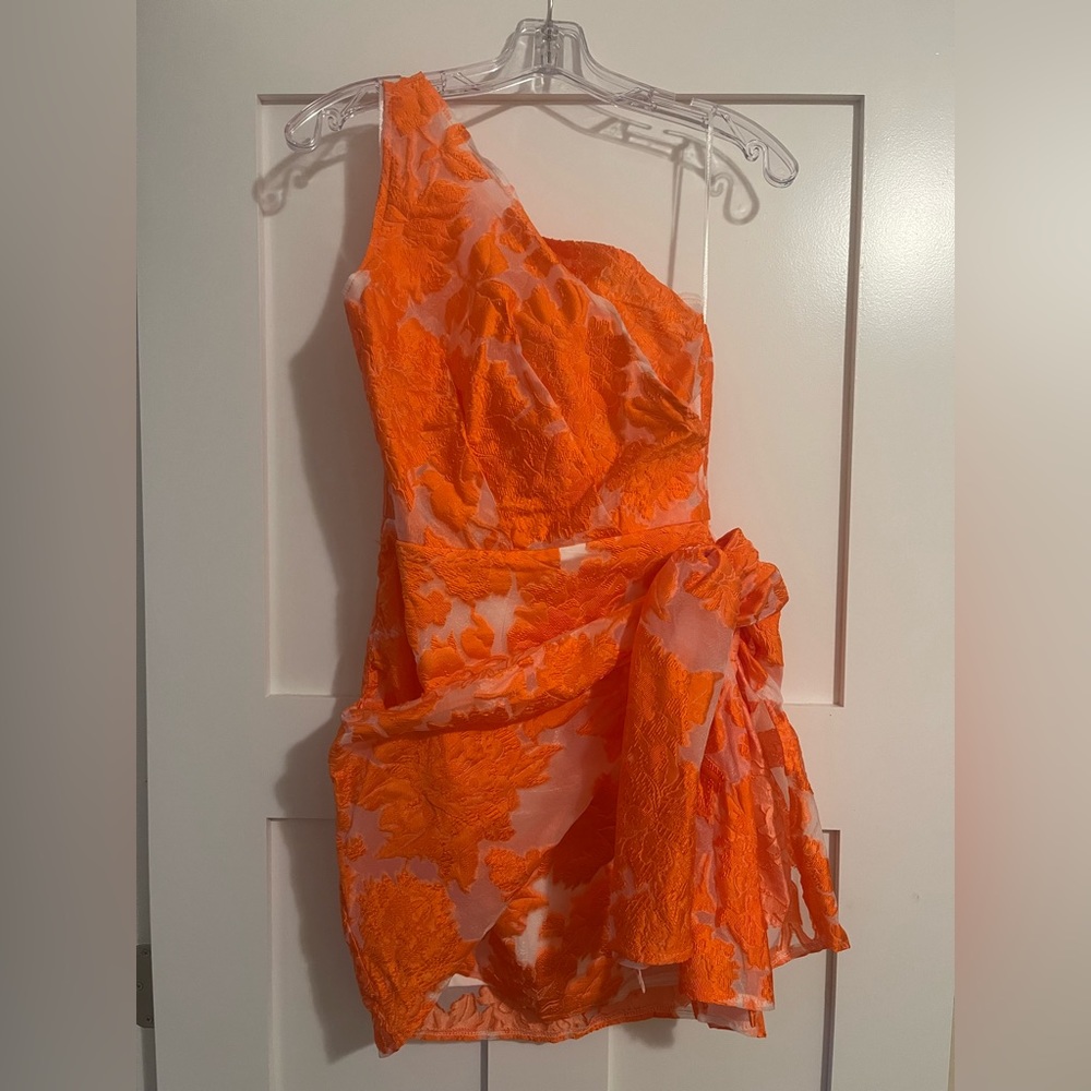 BRAILEY ONE SHOULDER WRAP FRONT MINI DRESS IN ORANGE JACQUARD